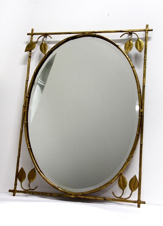 espejo ovalado vintage y biselado con marco de hierro